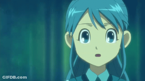 A Girl With Blue Hair And A Blue Shirt And Tie GIF