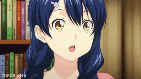 A Girl With Blue Hair And A Flower In Her Hair Is Standing In Front Of A Bookshelf GIF