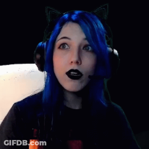 A Girl With Blue Hair And Black Lipstick Is Wearing Headphones And Cat Ears . GIF