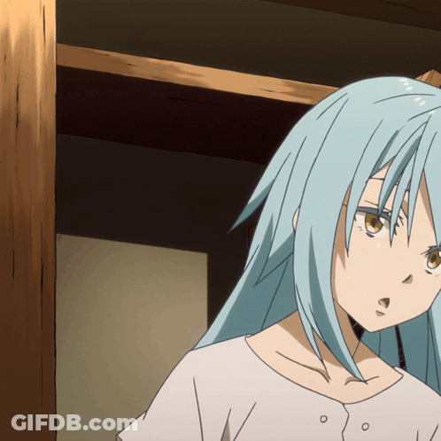A Girl With Blue Hair And Brown Eyes Is Standing In A Room GIF