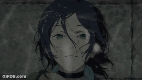 A Girl With Blue Hair And Green Eyes Looks At The Camera GIF