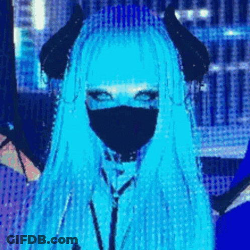 A Girl With Blue Hair And Horns Is Wearing A Mask And Has Blue Eyes . GIF
