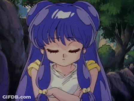A Girl With Blue Hair Has Her Eyes Closed And Is Wearing A White Shirt GIF