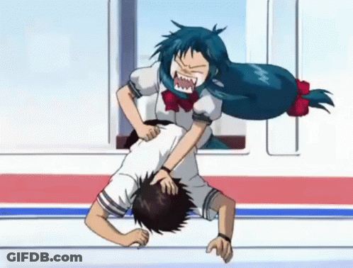 A Girl With Blue Hair Is Fighting A Boy On The Floor . GIF