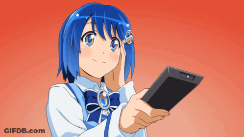 A Girl With Blue Hair Is Holding A Cell Phone In Her Hand GIF