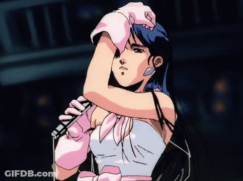 A Girl With Blue Hair Is Holding A Microphone GIF