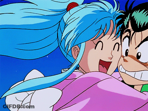 A Girl With Blue Hair Is Hugging A Boy GIF