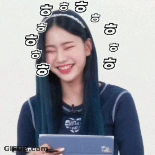 A Girl With Blue Hair Is Smiling And Holding A Tablet GIF