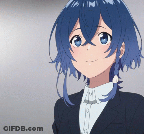 A Girl With Blue Hair Is Smiling And Wearing A Suit GIF
