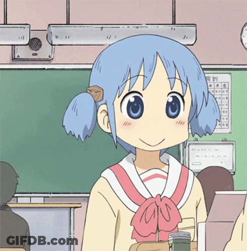 A Girl With Blue Hair Is Smiling In A Classroom With A Calendar On The Wall Behind Her GIF
