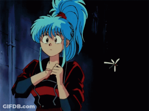 A Girl With Blue Hair Is Spraying Something In A Can GIF