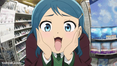 A Girl With Blue Hair Making A Funny Face With Her Tongue Out GIF