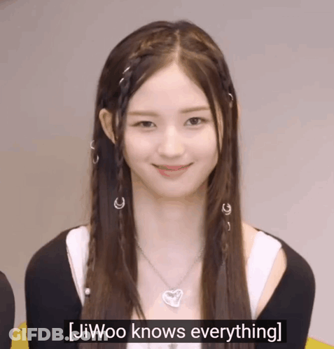 A Girl With Braids And A Necklace Says Jiwoo Knows Everything . GIF