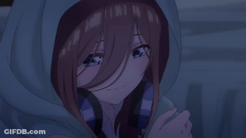 A Girl With Brown Hair And Blue Eyes Is Wearing A Hooded Jacket GIF