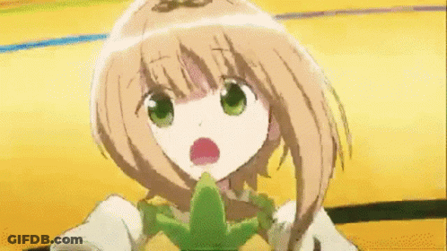 A Girl With Brown Hair And Green Eyes Is Holding A Green Object In Her Mouth GIF