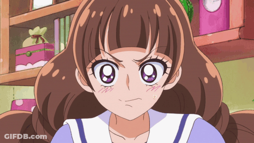 A Girl With Brown Hair And Purple Eyes Is Making A Angry Face GIF