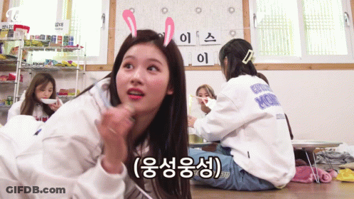 A Girl With Bunny Ears On Her Head Is Sitting On The Floor With Other Girls .. GIF