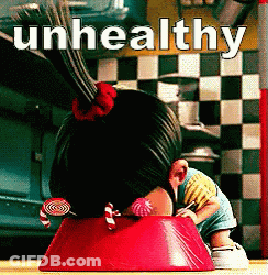 A Girl With Candy In Her Hair Is Sitting In A Red Bowl With The Words Unhealthy Written Above Her GIF