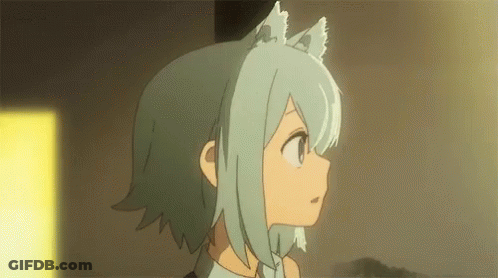 A Girl With Cat Ears Is Standing In A Room And Looking At Something . GIF