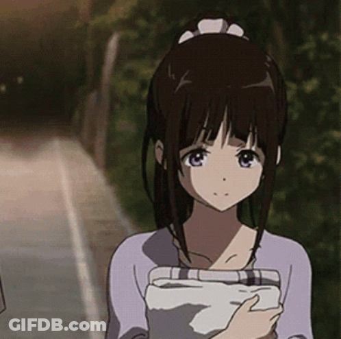 A Girl With Dark Hair Is Holding A Piece Of Paper GIF