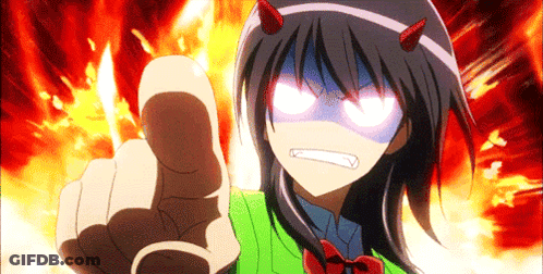 A Girl With Devil Horns On Her Head Is Pointing At The Camera GIF