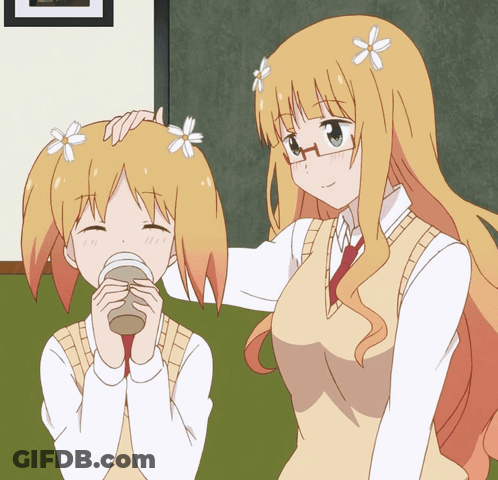 A Girl With Flowers In Her Hair Is Petting Another Girl 'S Hair GIF