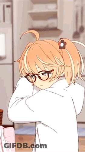 A Girl With Glasses And A Flower In Her Hair Is Standing In A Kitchen GIF