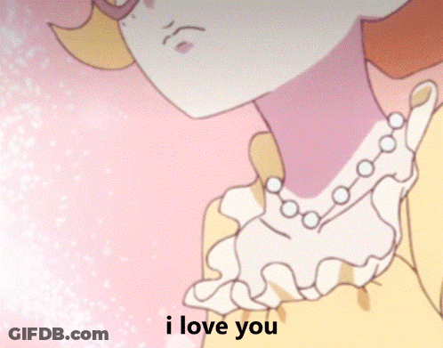 A Girl With Glasses And A Pearl Necklace Says " I Love You " GIF