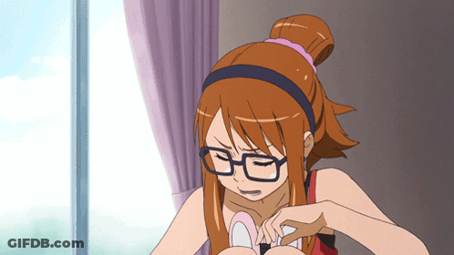 A Girl With Glasses And A Ponytail Is Looking Down GIF