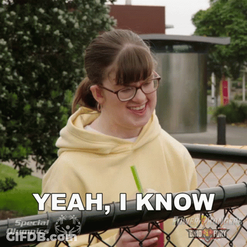 A Girl With Glasses And A Yellow Hoodie Says " Yeah , I Know " GIF