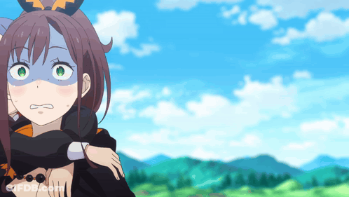 A Girl With Green Eyes Is Being Held By Another Girl In A Field GIF