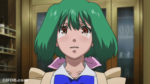 A Girl With Green Hair And A Blue Bow Tie Looks Sad GIF