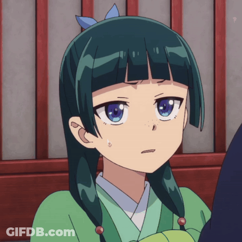 A Girl With Green Hair And Blue Eyes Is Making A Face GIF