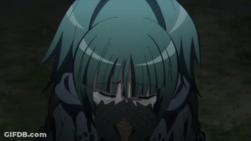 A Girl With Green Hair Is Crying With Her Hands Over Her Face GIF