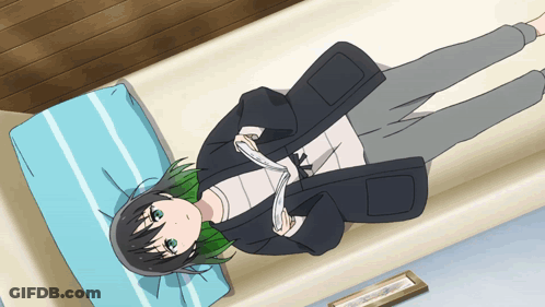 A Girl With Green Hair Is Laying On A Bed With A Picture In The Background GIF