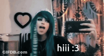 A Girl With Green Hair Is Taking A Selfie With A Cell Phone . GIF