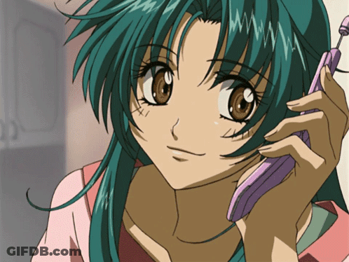 A Girl With Green Hair Is Talking On A Cellphone GIF