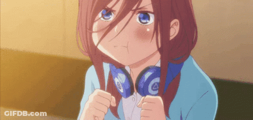 A Girl With Headphones Around Her Neck Is Making A Face GIF