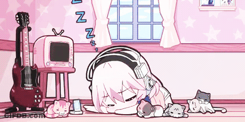A Girl With Headphones Is Sleeping On The Floor In A Room With Cats And A Guitar . GIF