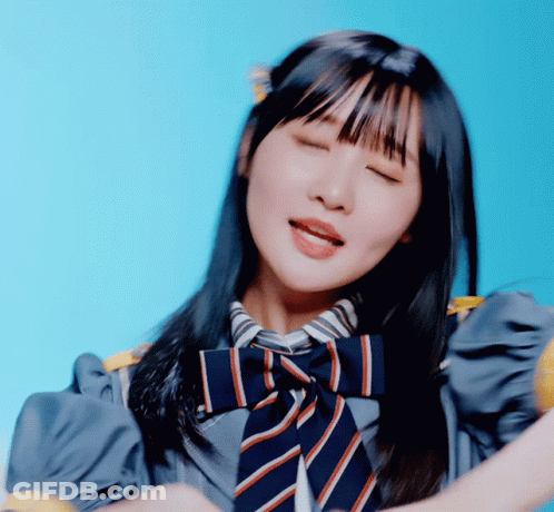 A Girl With Her Eyes Closed And A Striped Tie On GIF
