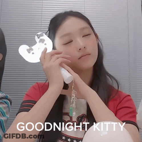 A Girl With Her Eyes Closed Has The Words Goodnight Kitty Written Below Her GIF