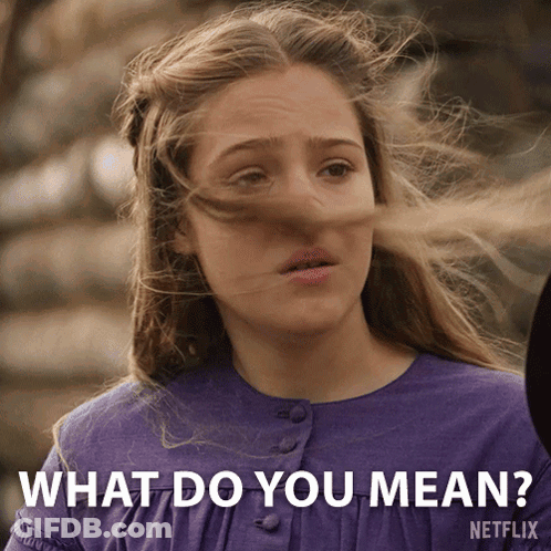 A Girl With Her Hair Blowing In The Wind Is Asking What Do You Mean GIF