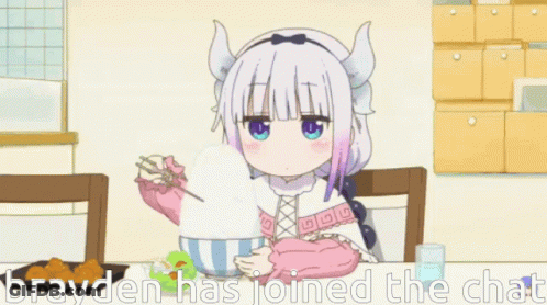 A Girl With Horns Is Sitting At A Table Eating A Bowl Of Food . GIF