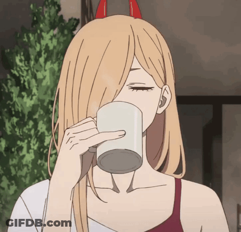 A Girl With Horns On Her Head Drinks From A Cup GIF