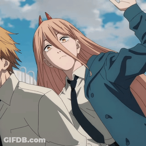 A Girl With Horns On Her Head Is Standing Next To A Man In A Suit GIF