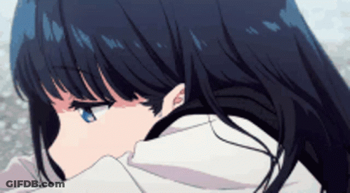 A Girl With Long Black Hair And Blue Eyes Is Looking Down GIF