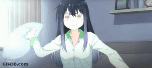 A Girl With Long Black Hair Is Holding A Pillow GIF