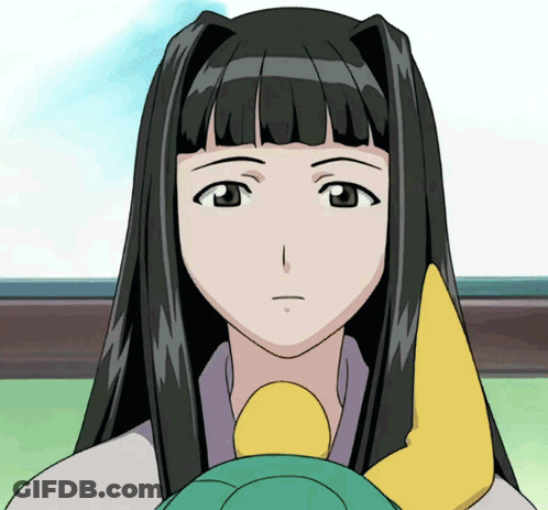 A Girl With Long Black Hair Is Holding A Yellow Object In Her Hand GIF