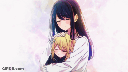 A Girl With Long Black Hair Is Hugging Another Girl GIF