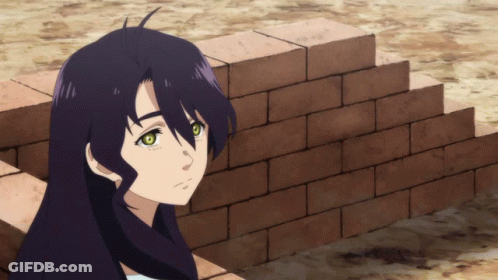 A Girl With Long Black Hair Is Leaning Against A Wall GIF